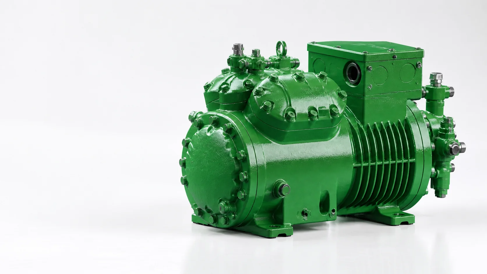Generic green semi-hermetic reciprocating compressor on a white studio background